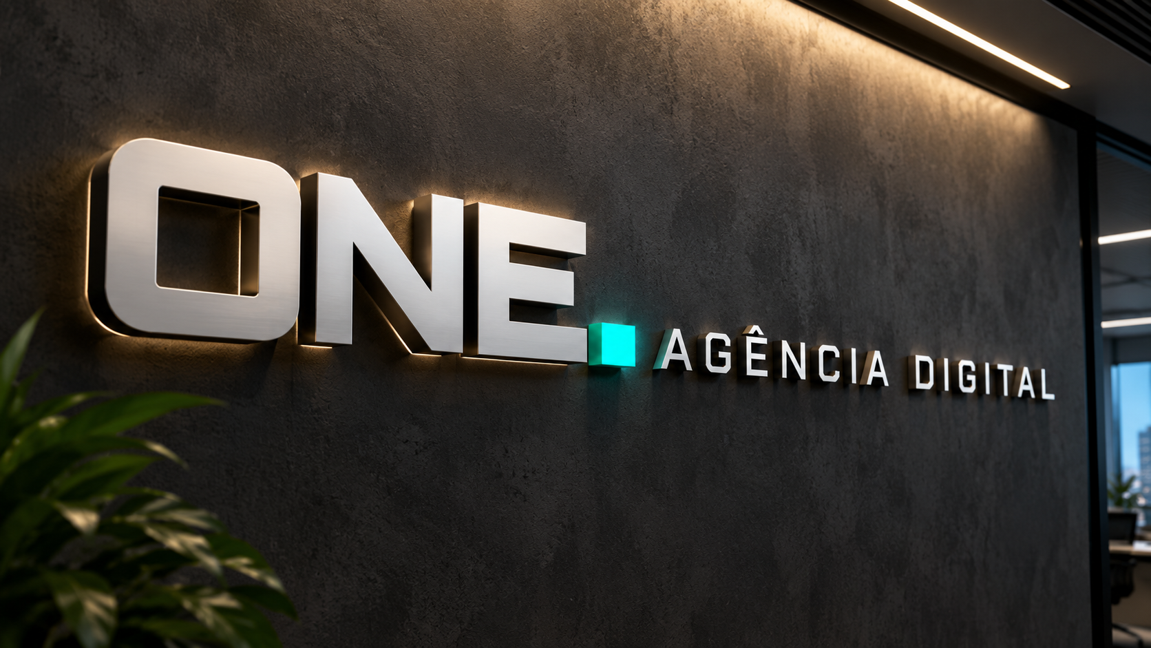 Logo ONE Agência Digital em letra caixa iluminada na parede da recepção